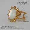 Gold ring with a pearl-like stone, showing adjustable size and measurements on a gray background.