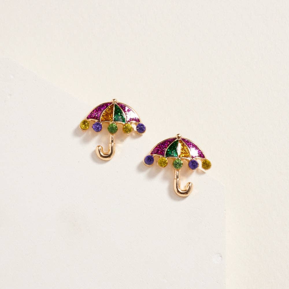 Colorful umbrella-shaped earrings on a light beige background