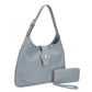 Blue handbag with matching wallet on a white background