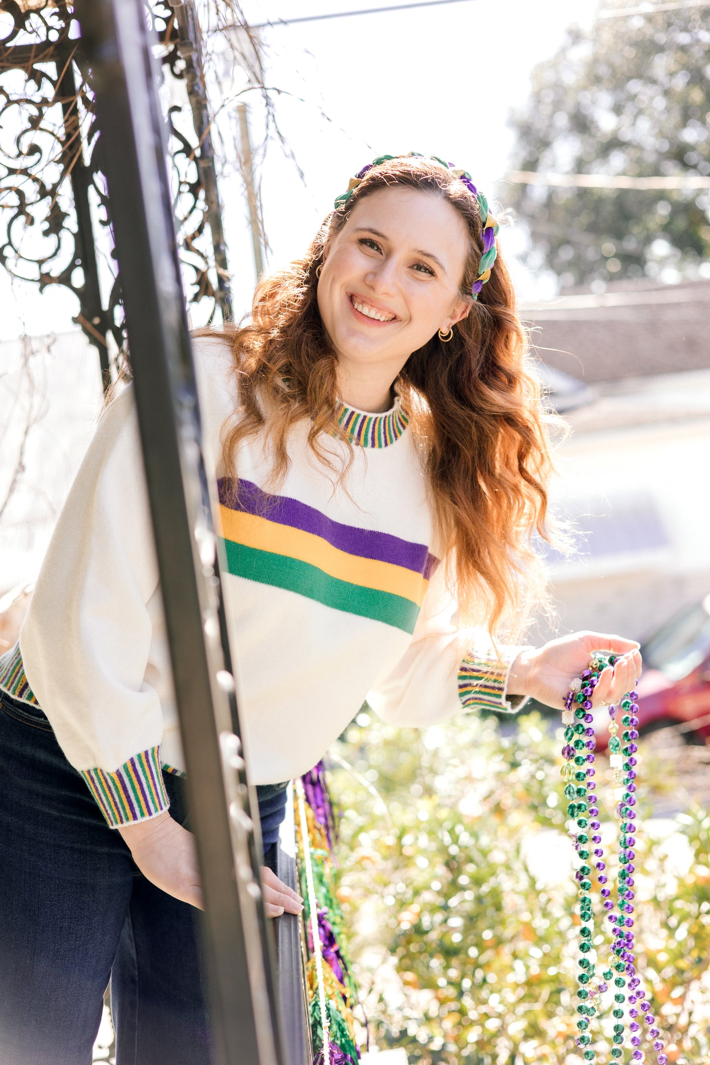 white sweater with mardi gras stripes