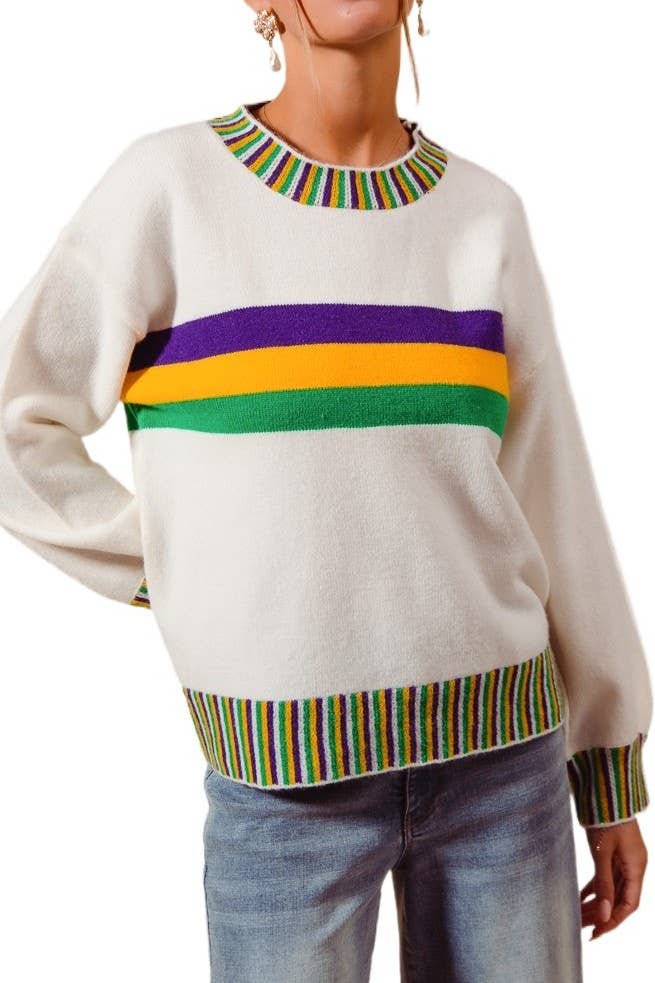 Beige sweater with colorful stripes worn by a person on a white background